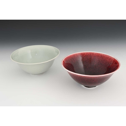 676 - John Masterton (British, 20th/21st Century), a copper red stoneware bowl and a celadon bowl, largest... 