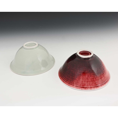 676 - John Masterton (British, 20th/21st Century), a copper red stoneware bowl and a celadon bowl, largest... 