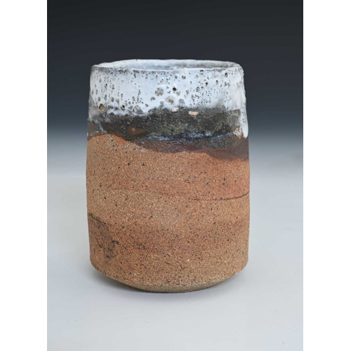 677 - Robin Welch (British, 1936-2019), a cylindrical vase, decorated with a white glaze over a textured c... 