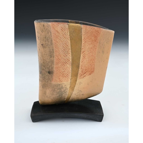 680 - Anne James (British, 1937), a smoked fired vessel, mounted on a black ceramic base, decorated with c... 