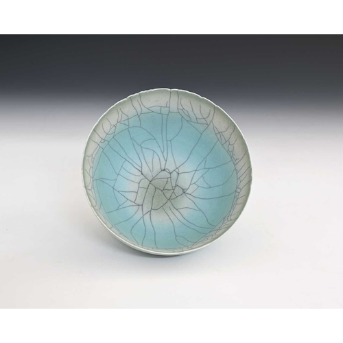 682 - David White (British, 1934-2011), a carved rim porcelain bowl, decorated with a light turquoise crac... 