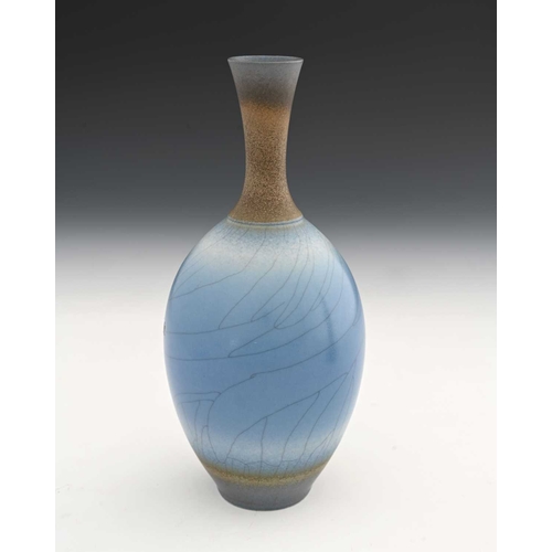 683 - David White (British, 1934-2011), a porcelain narrow-necked bottle vase, decorated with a blue crack... 