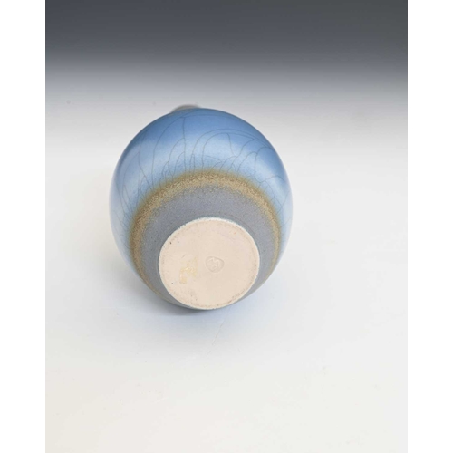 683 - David White (British, 1934-2011), a porcelain narrow-necked bottle vase, decorated with a blue crack... 