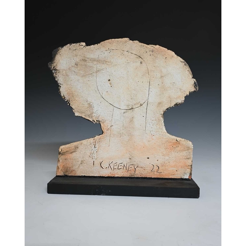 686 - Christy Keeney (British, 1958), a female head in low relief looking left, mounted on a wooden base, ... 