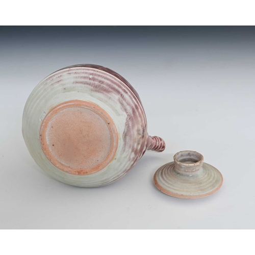 689 - Mary Rich (British, 1940-2022), a stoneware cane-handled teapot and cover, decorated with a pale whi... 