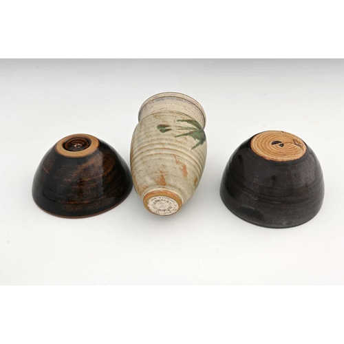 690 - Chris Carter (British, 1945), two tenmoku bowls, maker's mark to the base, and a vase with Draycott ... 