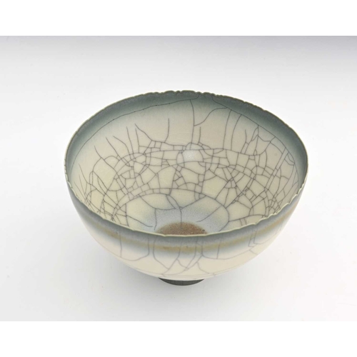 692 - David White (British, 1934-2011), a carved rim porcelain bowl, decorated with a pale grey crackle gl... 