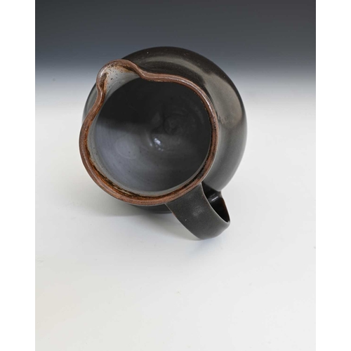 694 - Edmund de Waal (British, 1964), an early stoneware jug, tenmoku glaze exterior with a fine flecked l... 