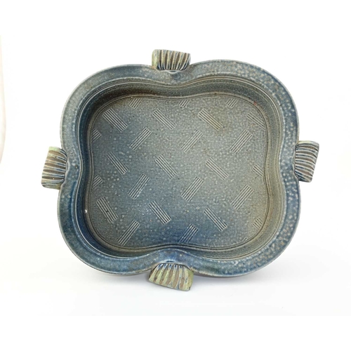 699 - Jane Hamlyn, a studio pottery salt glazed stoneware dish, quatrelobed form with reeded handles and c... 