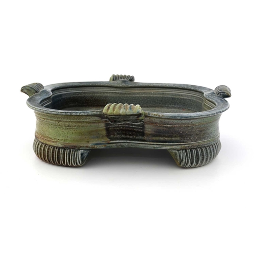 699 - Jane Hamlyn, a studio pottery salt glazed stoneware dish, quatrelobed form with reeded handles and c... 