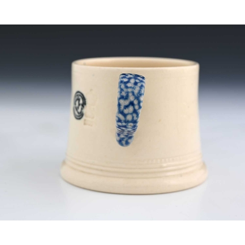 700 - Steve Harrison, a studio pottery mug, 2000, the tapered white glazed body with plate mounted salt ga... 