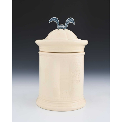 704 - Steve Harrison, a studio pottery jar and cover, 2000, white glazed cylindrical form with dimpled sid... 