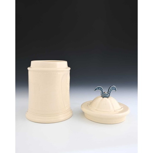 704 - Steve Harrison, a studio pottery jar and cover, 2000, white glazed cylindrical form with dimpled sid... 