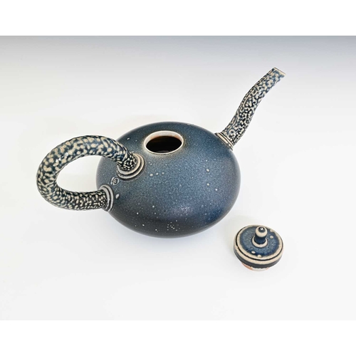 711 - Walter Keeler, a studio pottery salt glazed teapot, squat ovoid body in matte blue with disc lid, ap... 