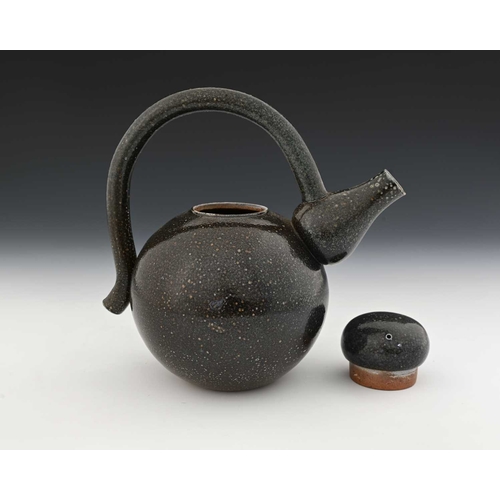 712 - Walter Keeler, a studio pottery salt glazed stoneware teapot, the spherical body with baluster cone ... 