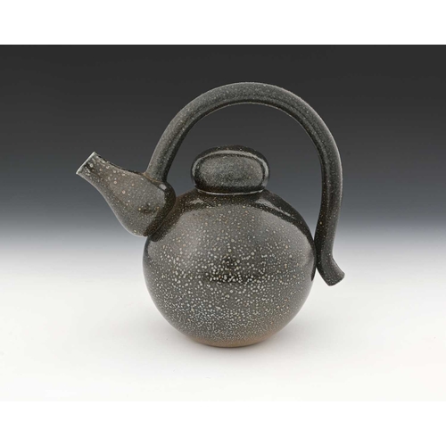 712 - Walter Keeler, a studio pottery salt glazed stoneware teapot, the spherical body with baluster cone ... 