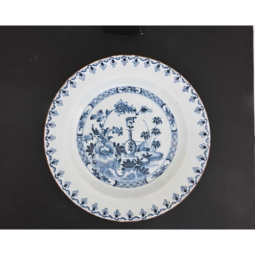 751 - A Liverpool Delft blue and white charger, circa 1740, together with a Dutch Wanli style charger circ... 