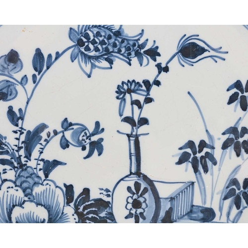 751 - A Liverpool Delft blue and white charger, circa 1740, together with a Dutch Wanli style charger circ... 