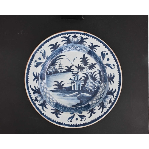 752 - A Lambeth Delft blue and white dish, circa 1780, painted with foliate decoration, 34.5cm diameter