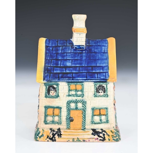 753 - A Northern English or Scottish pottery money box, circa 1830, in the form of a house