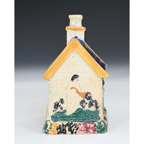 753 - A Northern English or Scottish pottery money box, circa 1830, in the form of a house