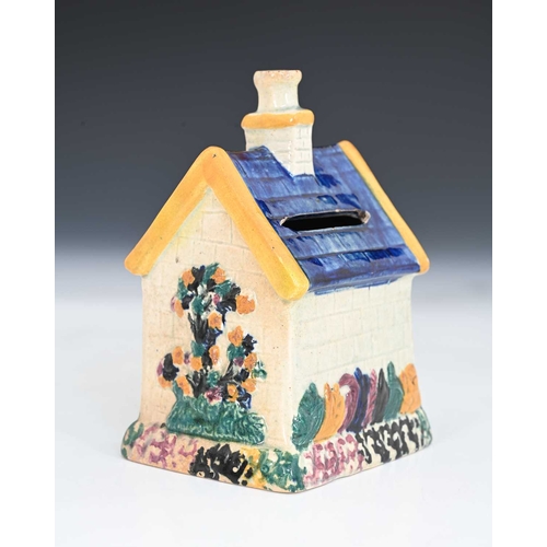 753 - A Northern English or Scottish pottery money box, circa 1830, in the form of a house