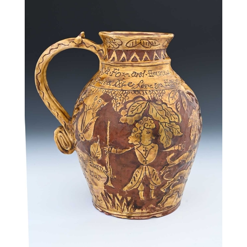 757 - An English slipware jug, sgraffito decorated in the West Country style with Ye Fox and Hounds, Phili... 