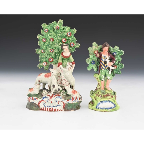 762 - Staffordshire pottery bocage figures of a shepherdess with sheep, lamb and dog, and a Walton figure ... 