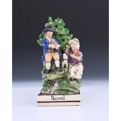 763 - A Staffordshire pottery pearlware figure group, circa 1820, titled Rural