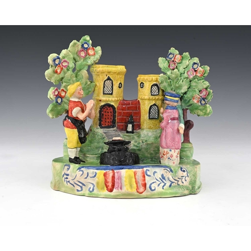 771 - A Staffordshire pottery pearlware figure, circa 1820, Gretna Green Wedding, with bocage and rainbow ... 