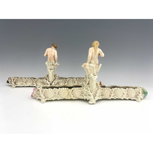 772 - A pair of Royal Worcester pearlescent lure figural centrepiece vases, each with a nymph type figure ... 