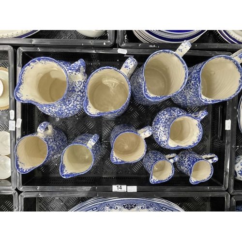 14 - A collection of Staffordshire blue and white spongeware pitchers and jugs, marks to bases, tallest 2... 