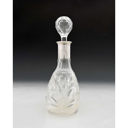 107 - An Elizabeth II silver-mounted decanter, with faceted bulbous glass body, the collar hallmarked 'B&B... 