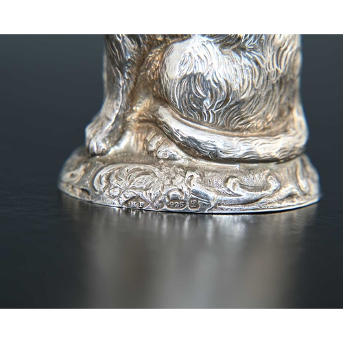 14 - A George V novelty silver pepperette, modelled in the form of a seated cat, the body decorated with ... 