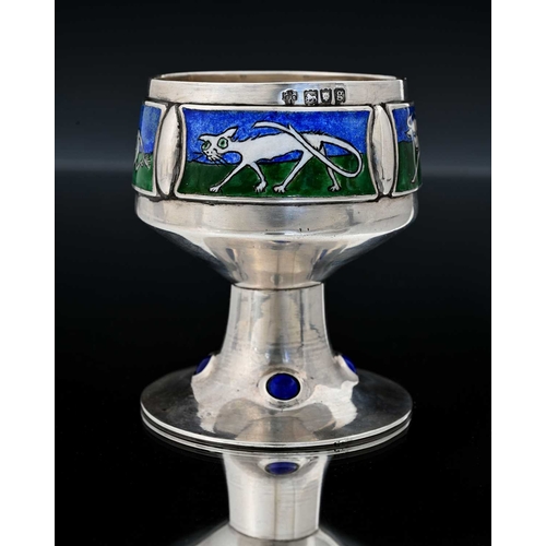 151 - An Edwardian Arts & Crafts silver and enamel goblet, the globular bowl section applied with four pla... 