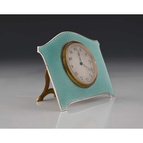 21 - A George V silver and enamel Art Deco style timepiece, of shaped rectangular form, decorated with gu... 