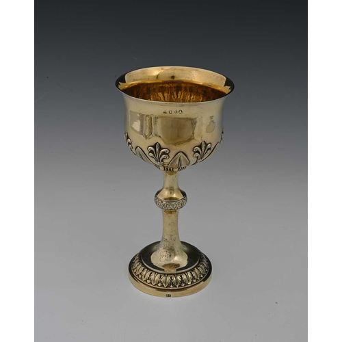 24 - A George IV Regency silver gilt cup, the bowl with flared rim, decorated with stiff foliage, and ant... 