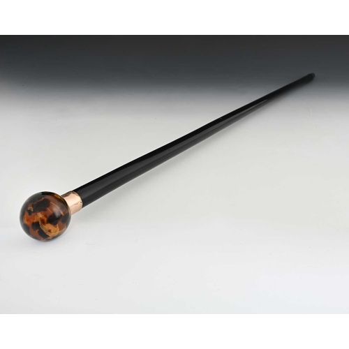 5 - Brigg of London. A nine-carat gold mounted walking cane, with ebonised shaft, and mottled resin type... 