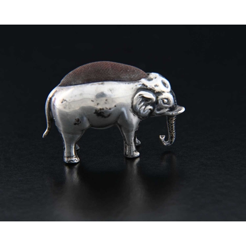 52 - An Edwardian silver novelty pin cushion, modelled in the form of a standing elephant, ensuite with c... 