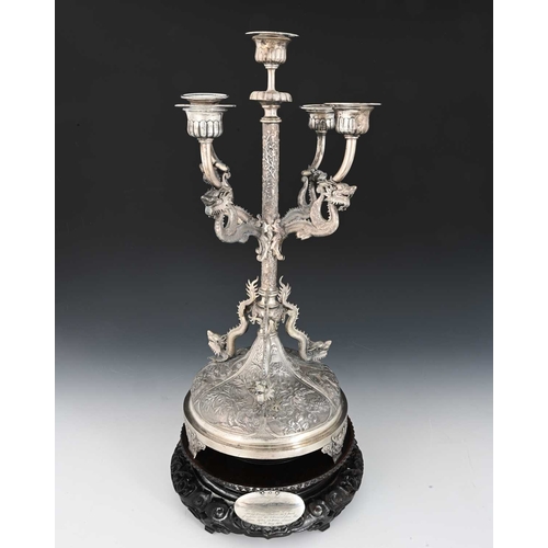 85 - China. A late nineteenth or early twentieth-century Chinese silver five-light candelabrum, the four ... 