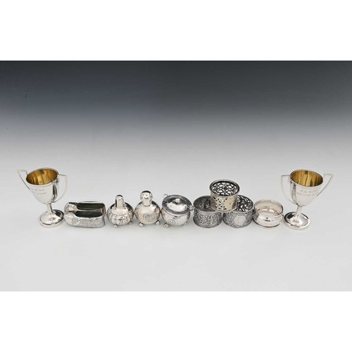 92 - China. A group of Chinese export silver-coloured metal wares, to include two miniature trophy cups, ... 