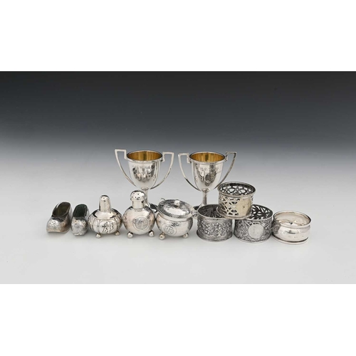 92 - China. A group of Chinese export silver-coloured metal wares, to include two miniature trophy cups, ... 