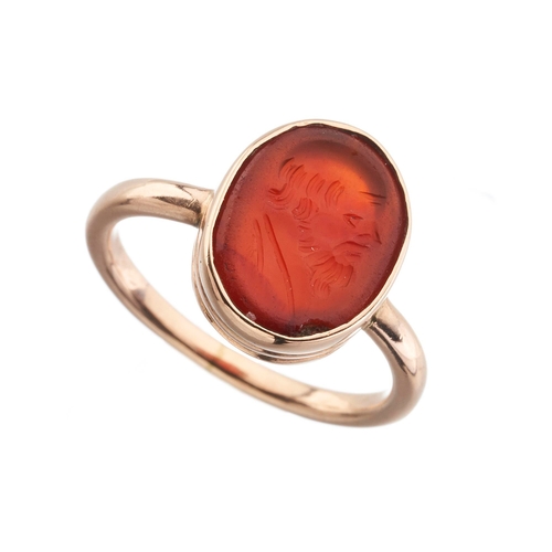 134 - A 19th century gold carnelian intaglio ring, possibly depicting Socrates in profile, ring size G, 2.... 