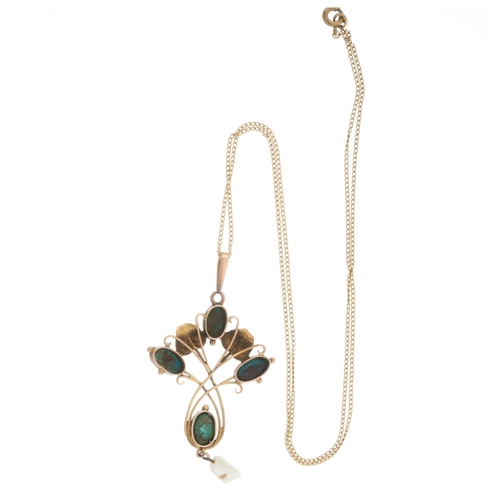 14 - An Art Nouveau gold turquoise cabochon and baroque pearl foliate pendant, with chain, length of pend... 