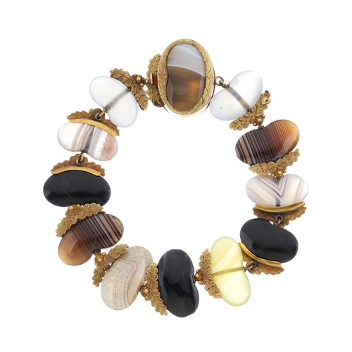 146 - An unusual Georgian gold agate bracelet, each gem carved into beans, with foliate half surround, len... 