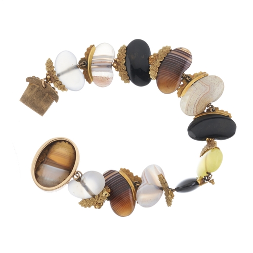 146 - An unusual Georgian gold agate bracelet, each gem carved into beans, with foliate half surround, len... 