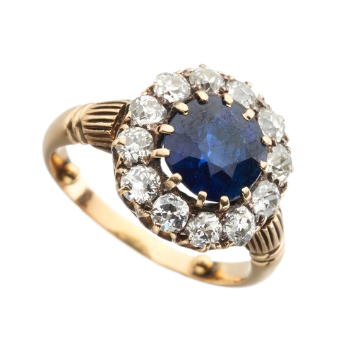 148 - A late Victorian gold cushion-shape sapphire and old-cut diamond cluster ring, with grooved shoulder... 