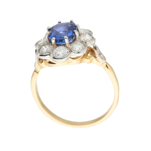 156 - An 18ct gold and platinum, cushion-shape sapphire and brilliant-cut diamond cluster ring, sapphire e... 