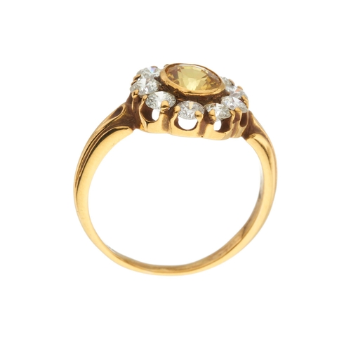 157 - An 18ct gold yellow sapphire and brilliant-cut diamond cluster ring, sapphire estimated weight 1.20c... 