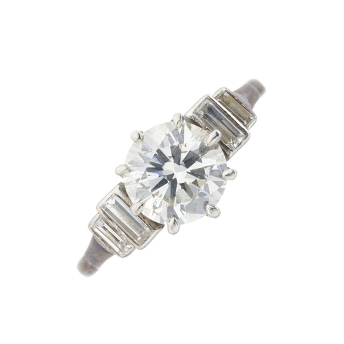 161 - An Art Deco platinum circular-cut diamond single-stone ring, with graduated rectangular-shape diamon... 